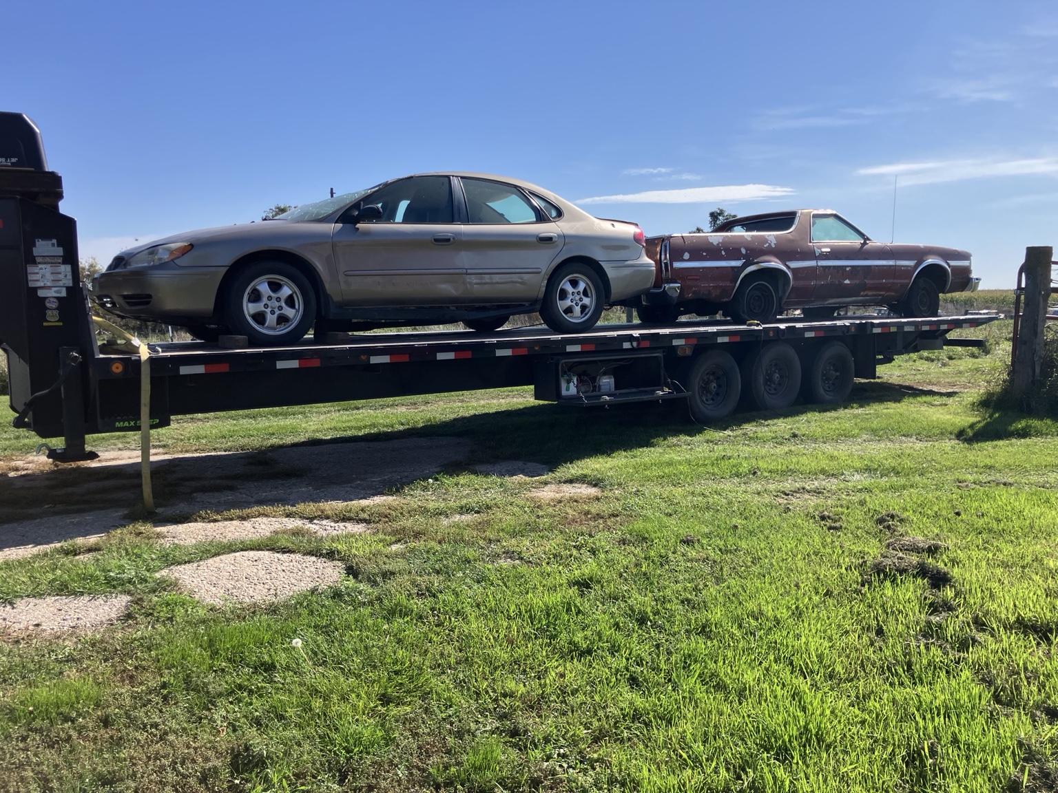 Vehicles loaded on trailer